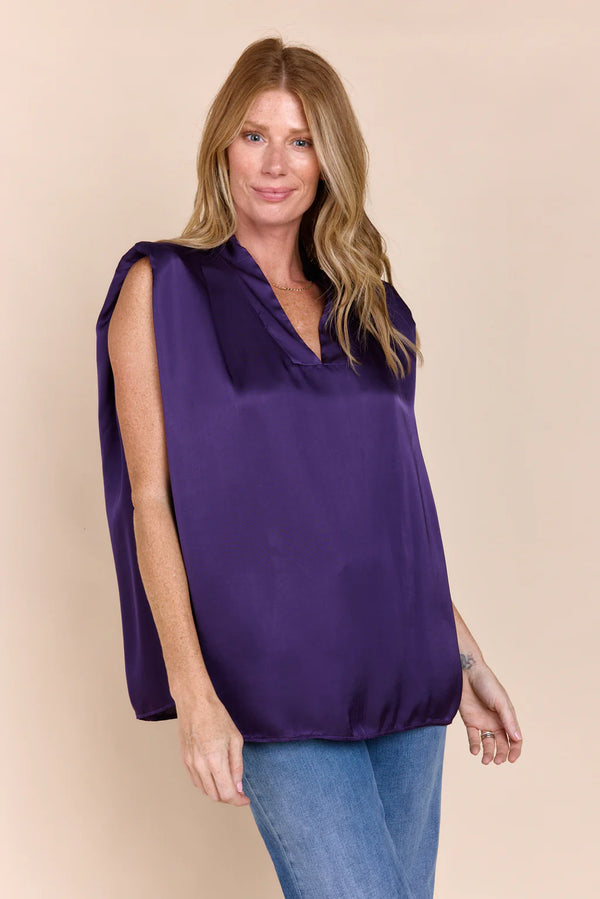 Woman wearing purple v-neck blouse