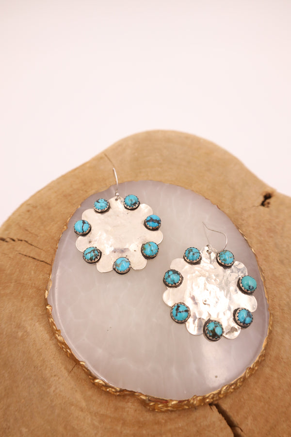Hammered sterling silver earrings in the shape of scallop with 7 turquoise rounds on each