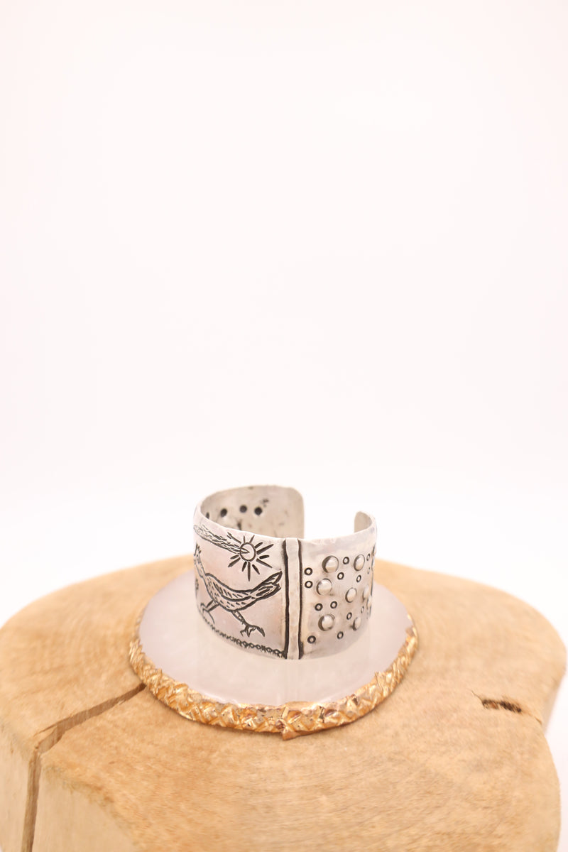 Sterling silver cuff with engraved roadrunner, cacti, sun and bubble details
