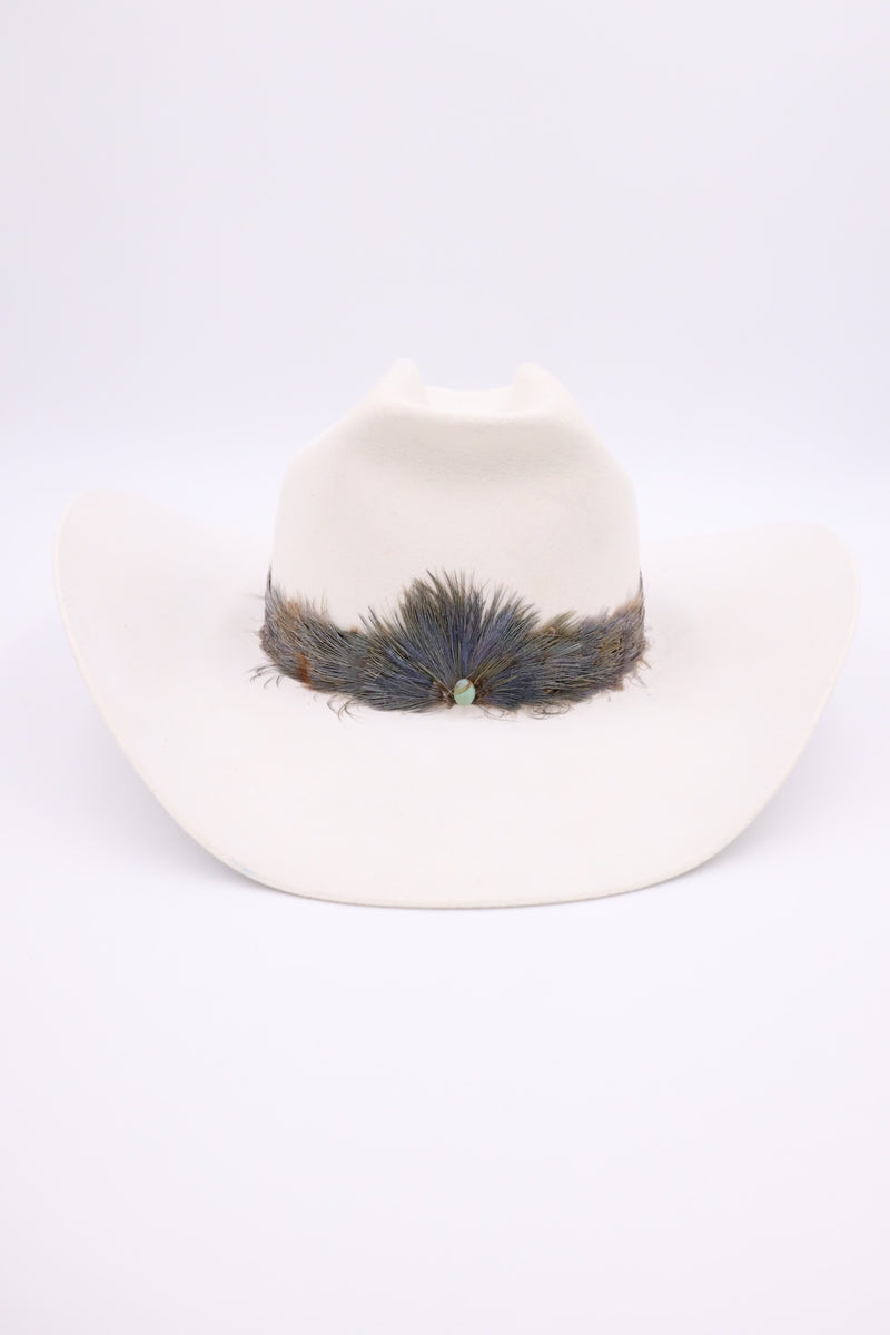 Old school western feather hatband with turquoise dot in the center of the feathers
