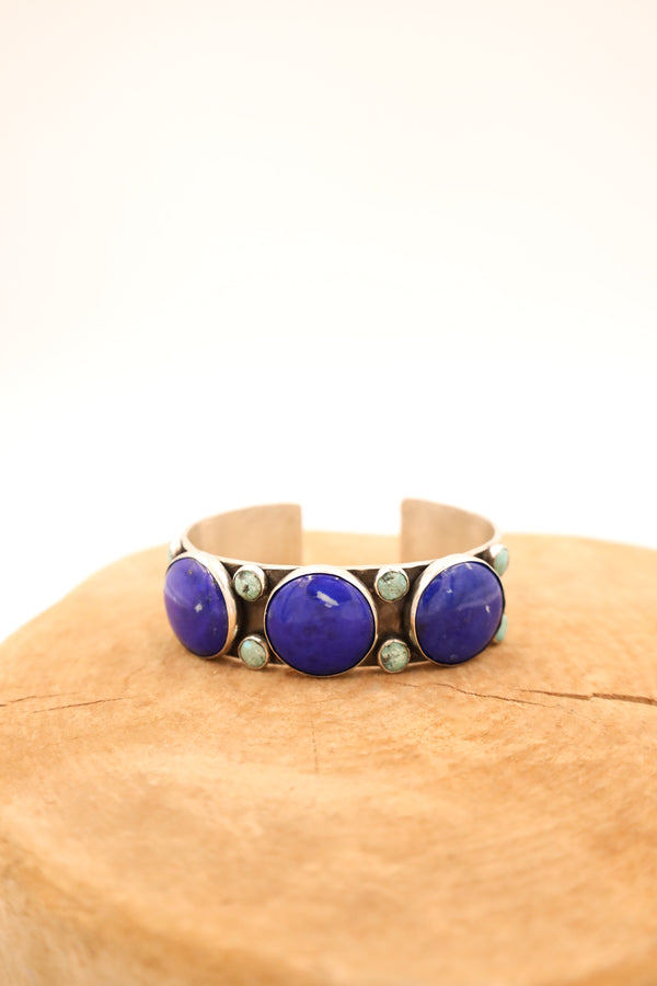Hammered sterling silver cuff features three beautiful lapis rounds adorned with eight turquoise dots