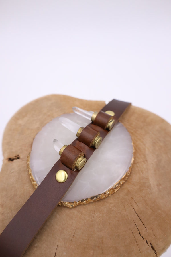 Featuring genuine leather, crystal adorned shotgun shells and an adjustable tie, this hatband is the perfect way to elevate your western style.