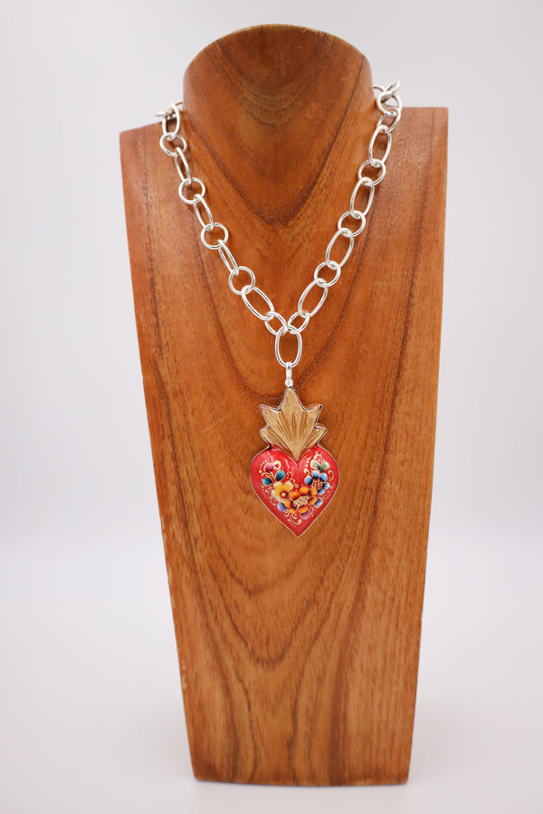 Red heart  adorned with flowers with gold crown pendant 