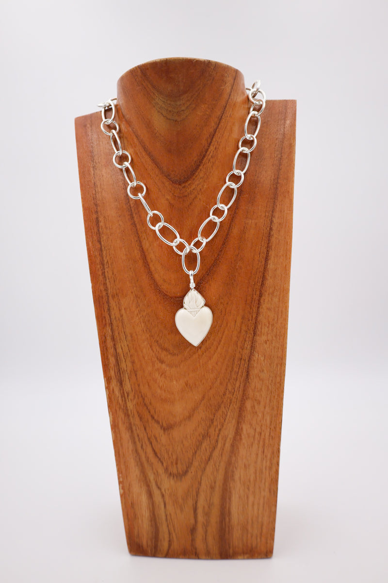 White heart pendant with crown on the top