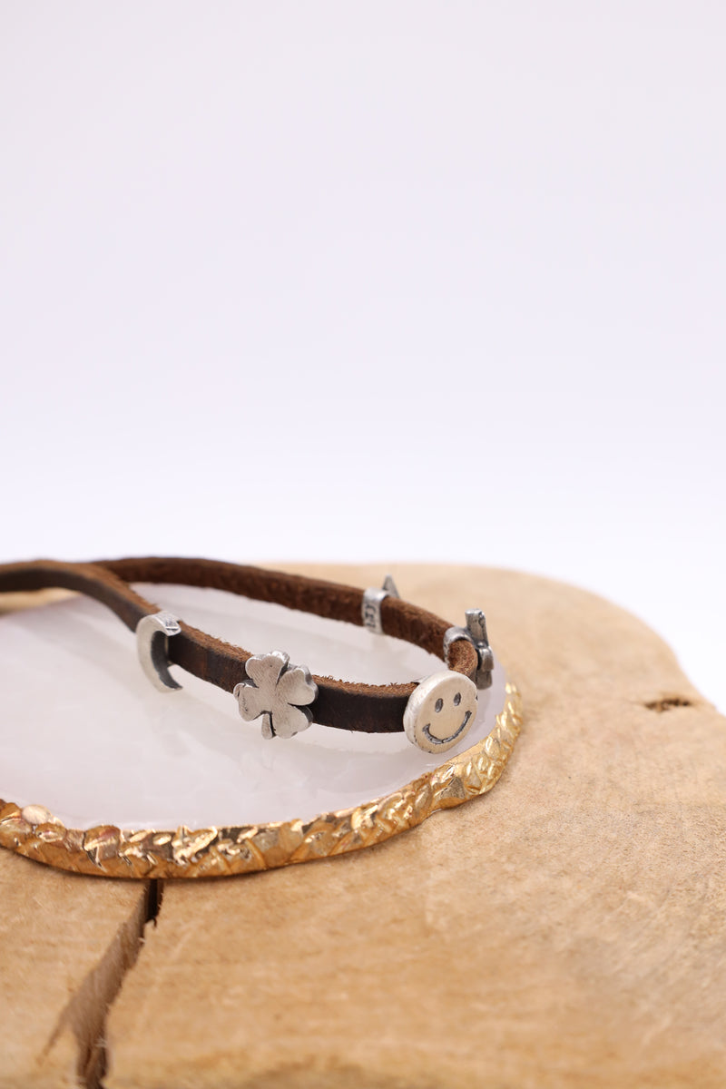 leather bracelet with sterling silver moon, clover, smiley, cactus and star charm
