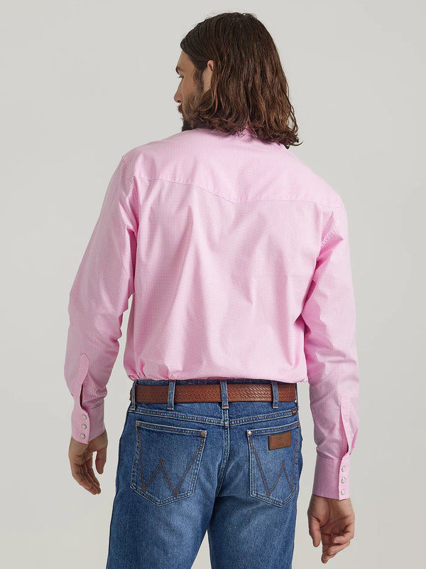 Man wearing long sleeve button front shirt with pink and white stripes