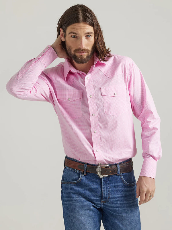 Man wearing long sleeve button front shirt with pink and white stripes