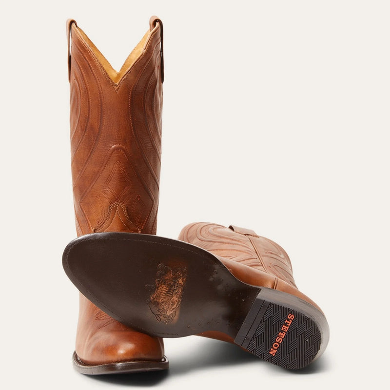 Brown cowboy boot with round toe and cording in shaft