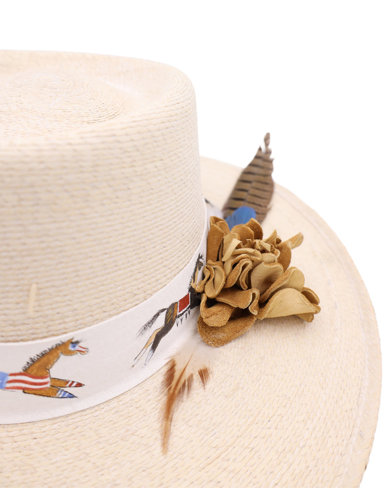 High-quality straw flat brim hat with boater crown is adorned with a white leather hat band, this hat features stunning hand-painted war horses and a tan leather rose with colorful feathers.