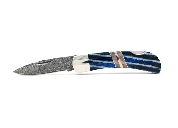 Knife with blue and white stripe handle with copper accent