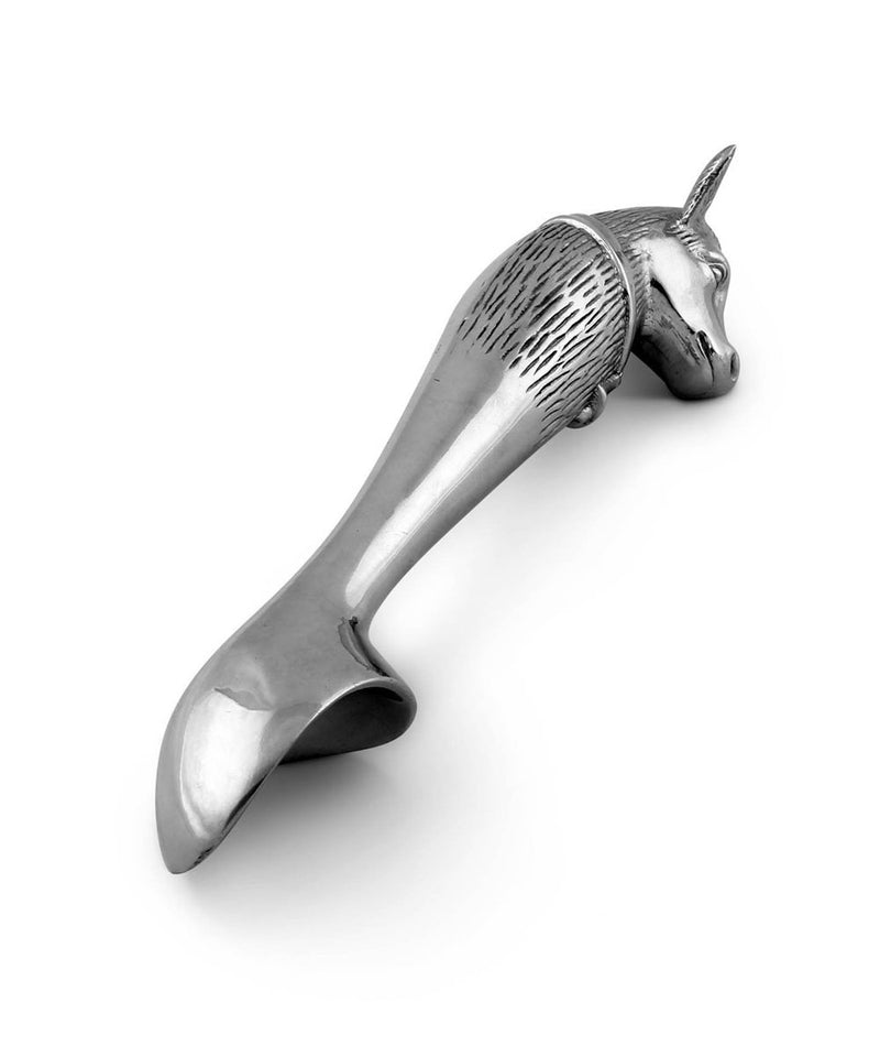 Silver ice cream scoop with cow head on the end of it