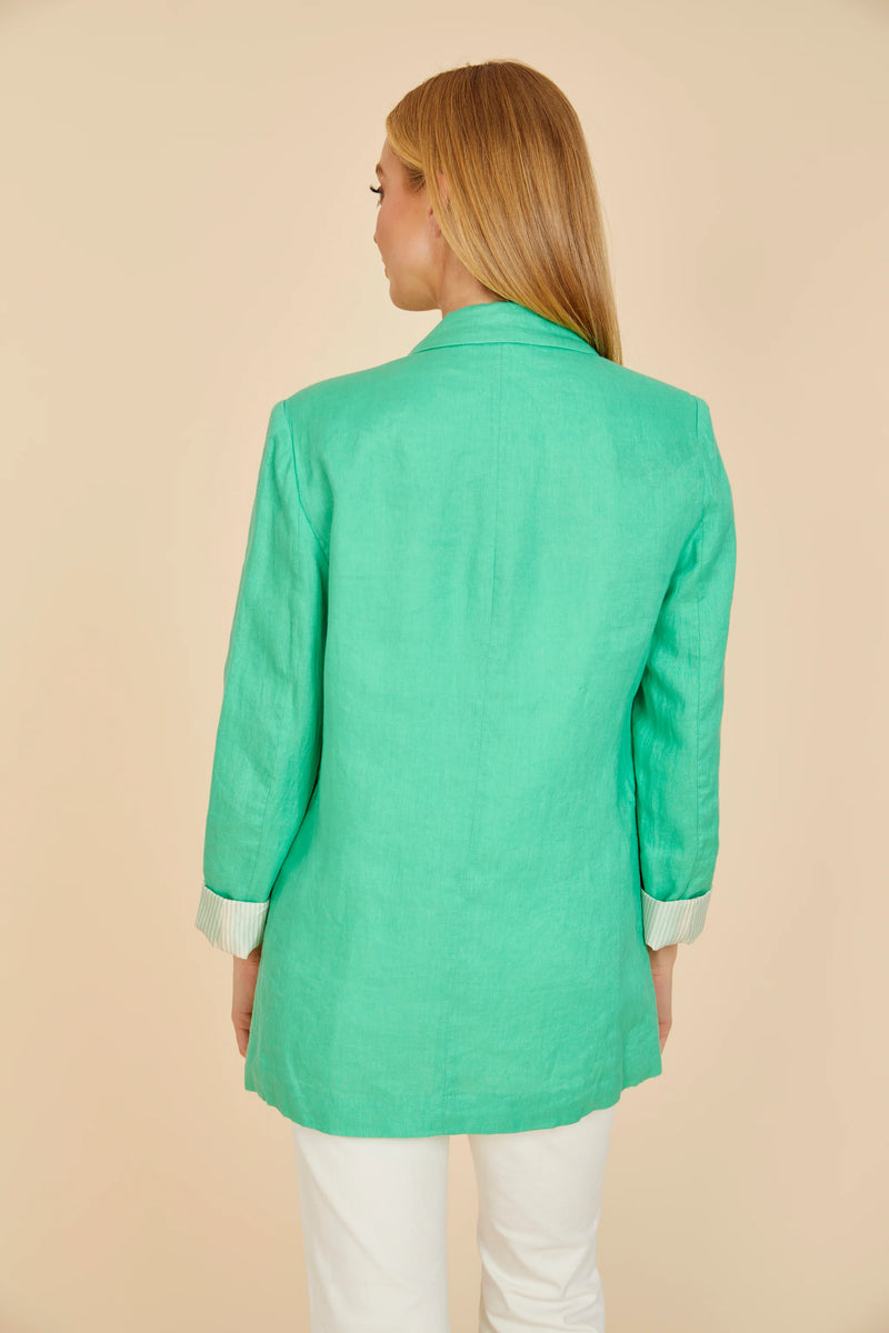 Woman wearing green linen blazer