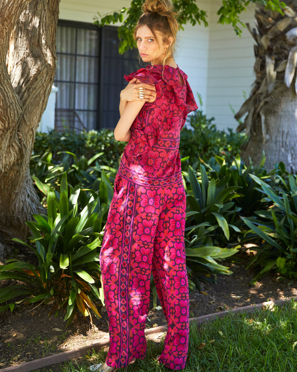 Floral pants in a purple, red and pink colorway with beading detail