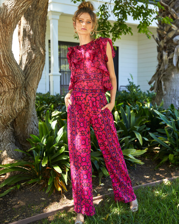Floral pants in a purple, red and pink colorway with beading detail