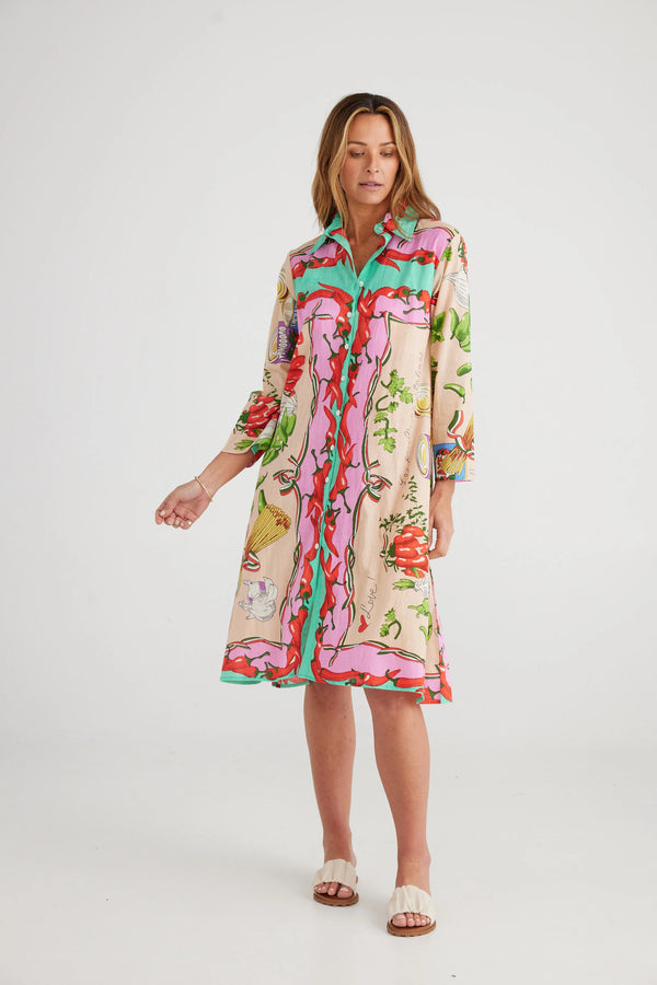 Woman wearing colorful long sleeve floral dress