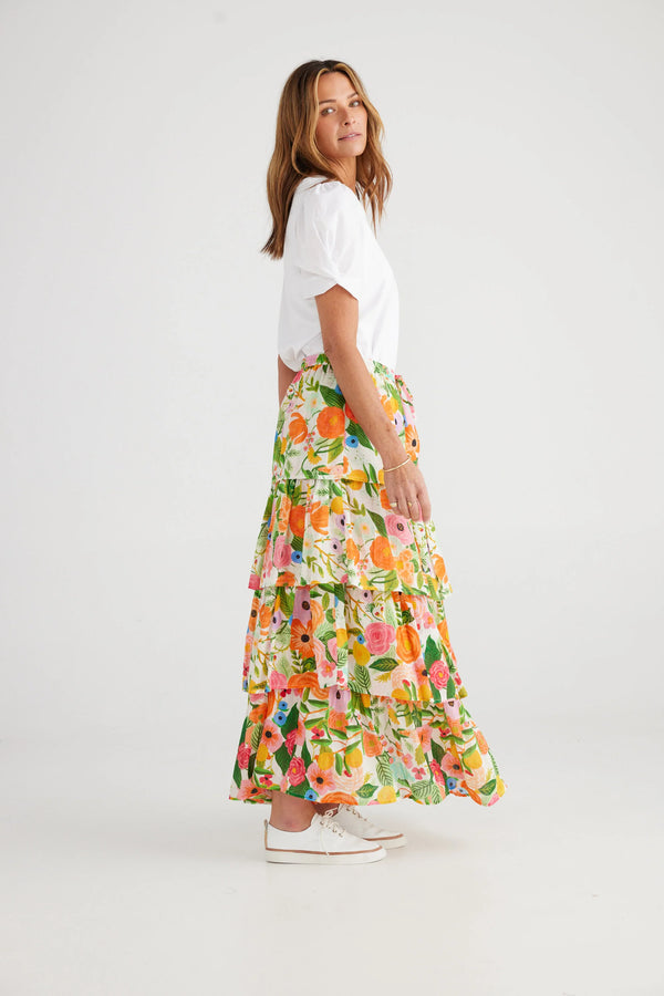 Woman wearing tiered floral skirt with elastic waistband