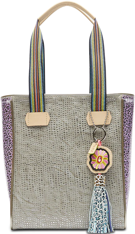 Textured tote bag with pink cheetah print side with flower tassel charm hanging off of stripe handles 