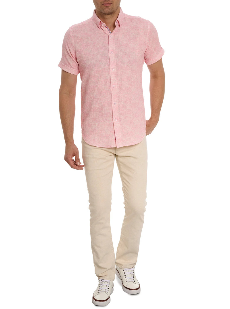 Man wearing short sleeve button down shirt in solid pink with button down front
