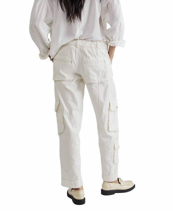 Woman wearing white cargo pants
