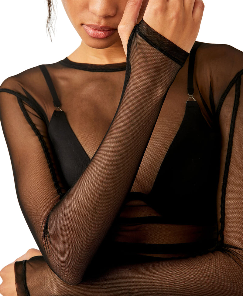 Woman modeling black sheer over shirt
