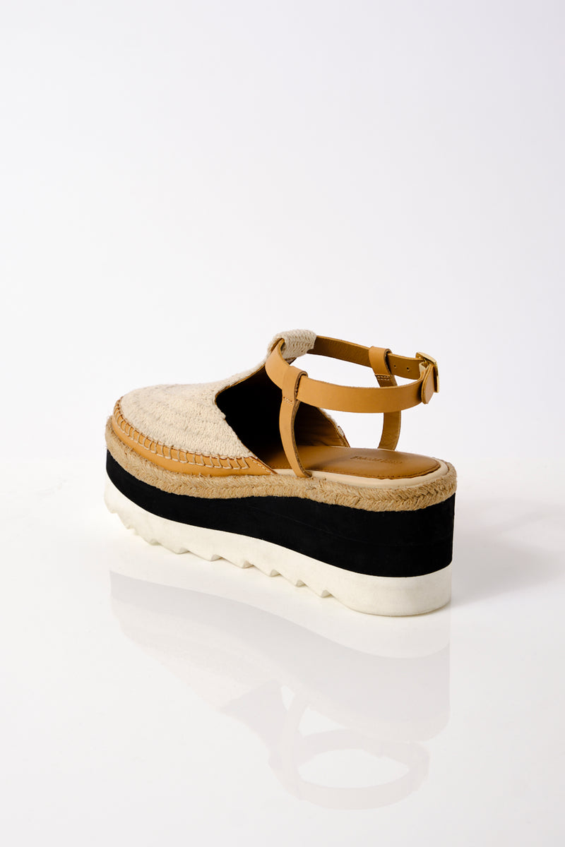 Knit sandal that covers top of foot, platform and attaches around the ankle