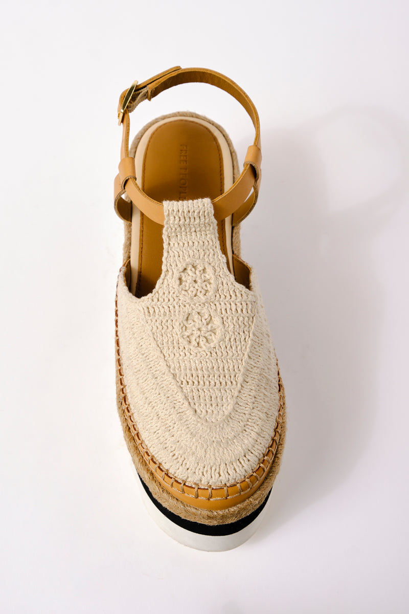 Knit sandal that covers top of foot, platform and attaches around the ankle