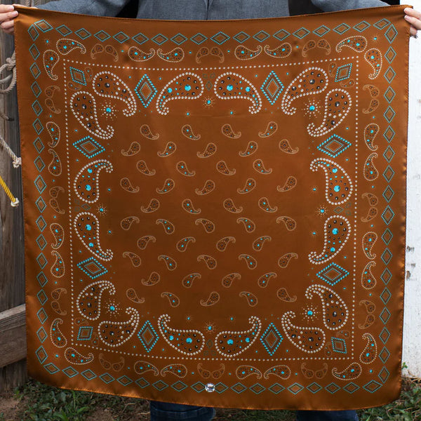 Rust color wild rag in a traditional bandana pattern