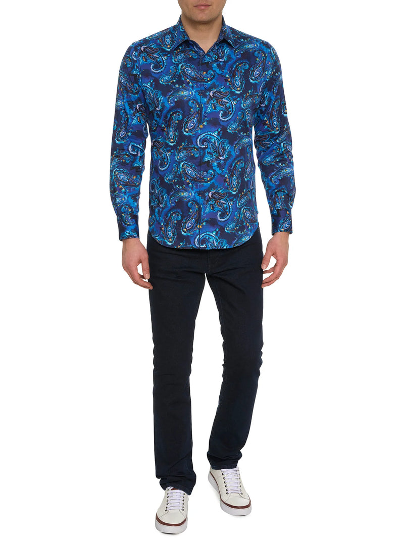 Man wearing long sleeve button down dress shirt with blue background and vibrant blue paisley print
