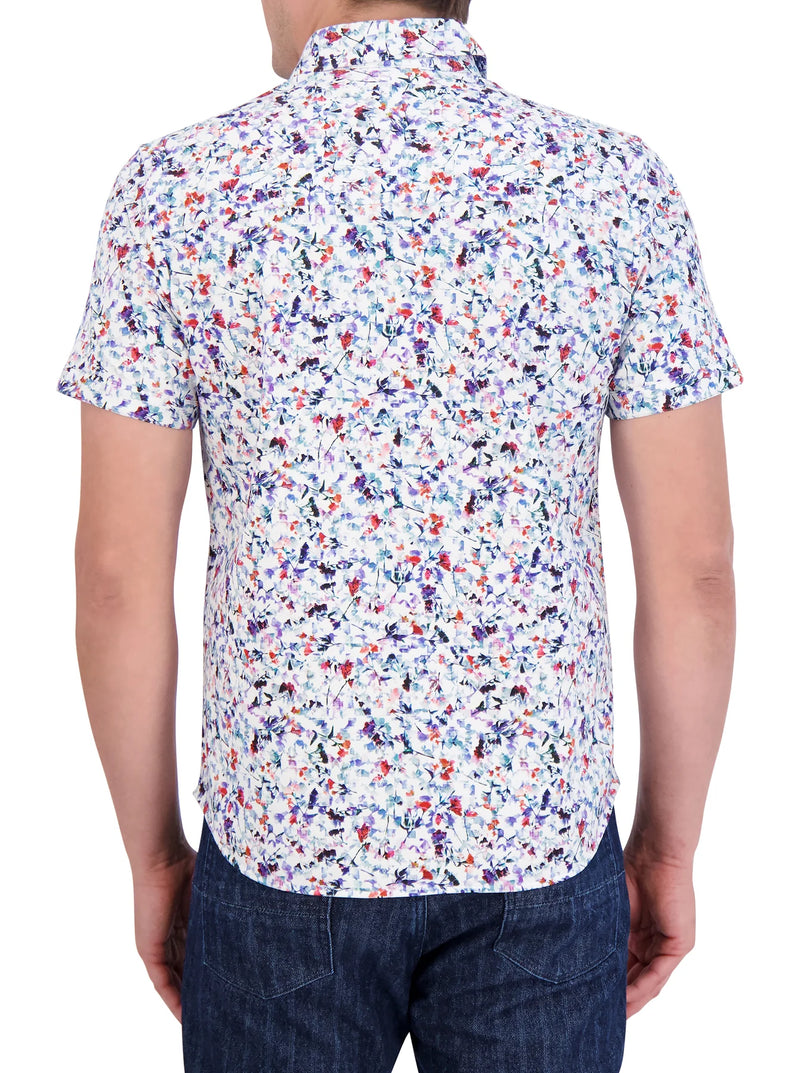 Man wearing short sleeve button front shirt with assorted flowers throughout