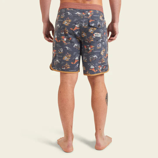 Men's swim shorts with grey background, image of cowskull, canyon, wagon wheel, and cacti all over