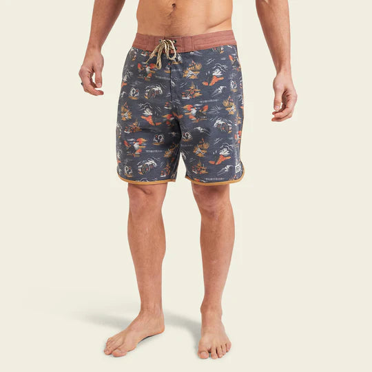 Men's swim shorts with grey background, image of cowskull, canyon, wagon wheel, and cacti all over