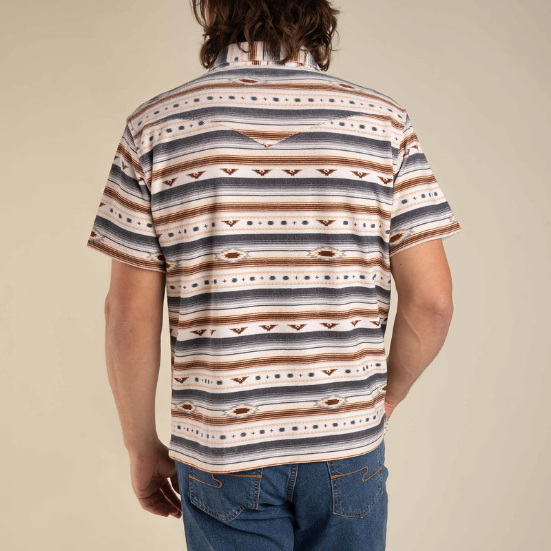 Men's polo in a terrycloth fabric with Aztec design with double breast pockets in a grey and brown colorway