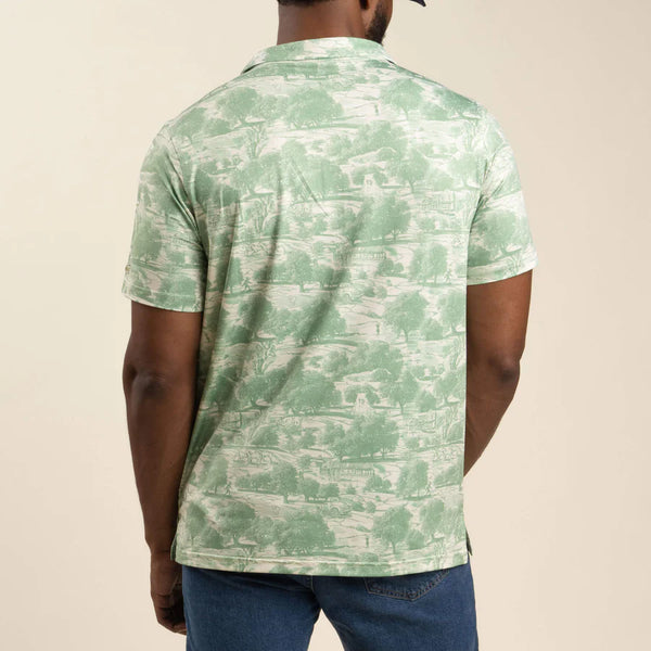 Green and white polo with scenery all over