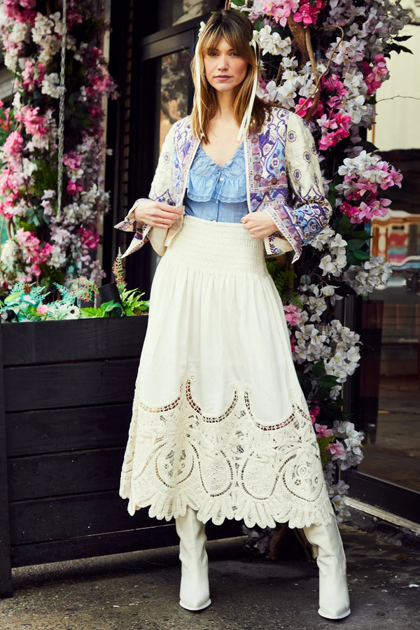 Cream color maxi skirt with lace detail in majority of the bottom of the skirt