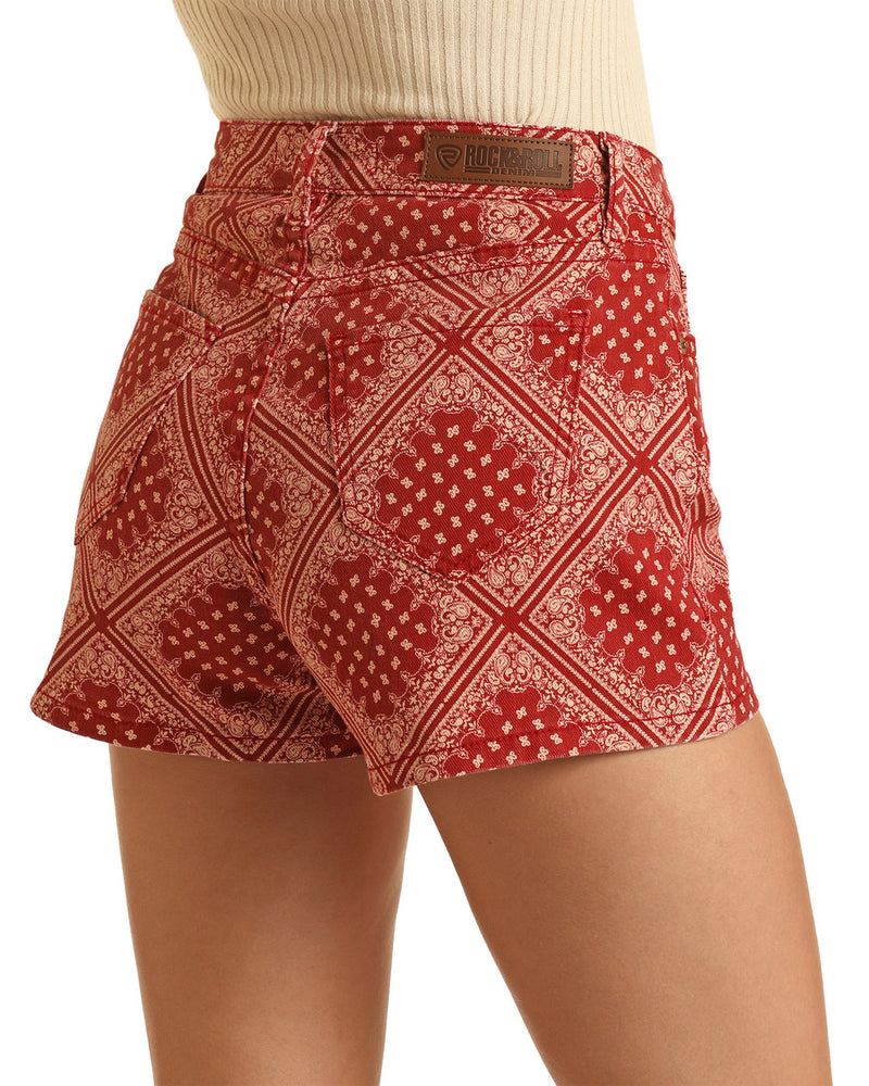 Woman wearing red bandana print high waisted shorts