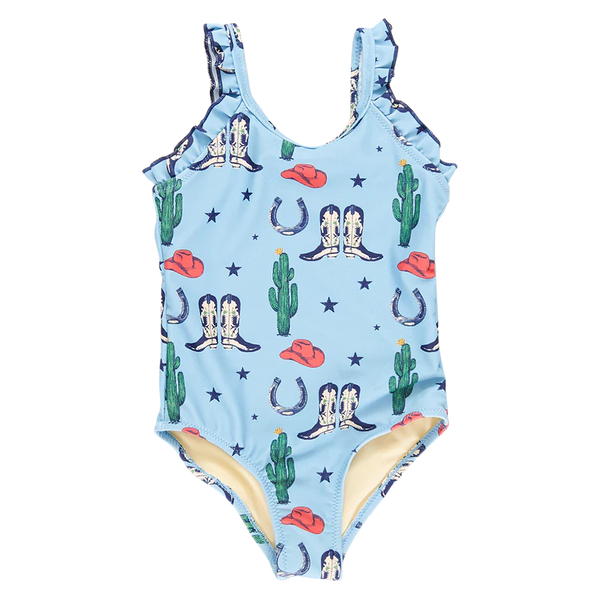 Little girls swimsuit with blue background, images of boots, cacti, stars and hats all over with ruffle straps