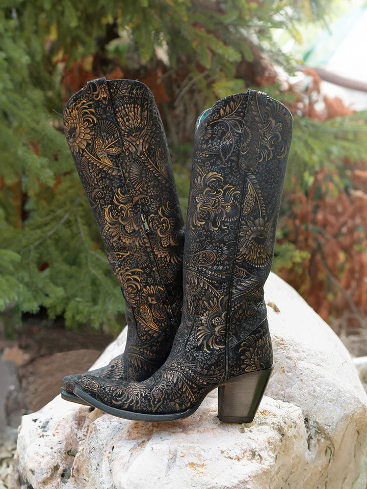 Black suede cowboy boots with gold accents in the pattern