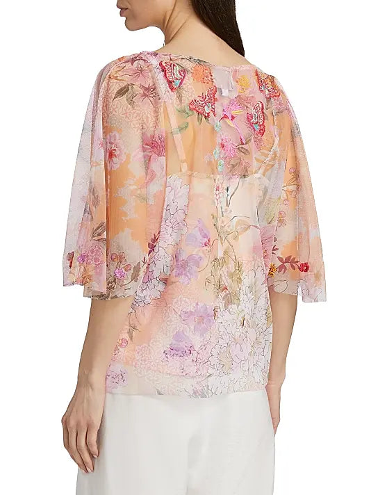 Floral blouse with sheer sleeves on a white background