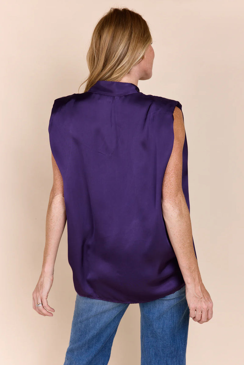 Woman wearing purple v-neck blouse