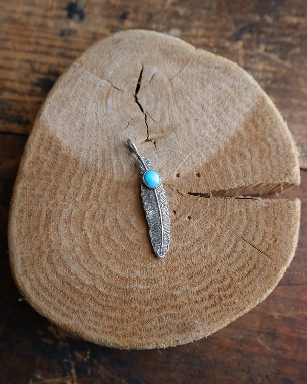 LOVE TOKENS STERLING SILVER FEATHER WITH TURQUOISE PENDANT