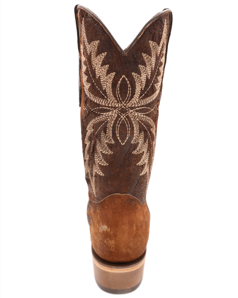 Intentionally distressed brown cowboy boots with narrow square toe