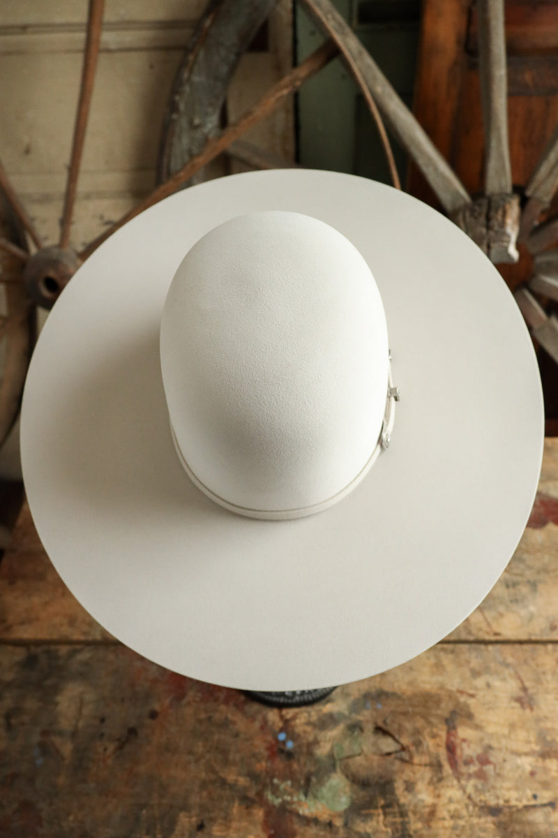 Cowboy hat on a wooden surface with rustic background