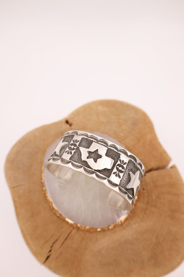 Sterling silver cuff with texas state in the center with stars on the sides