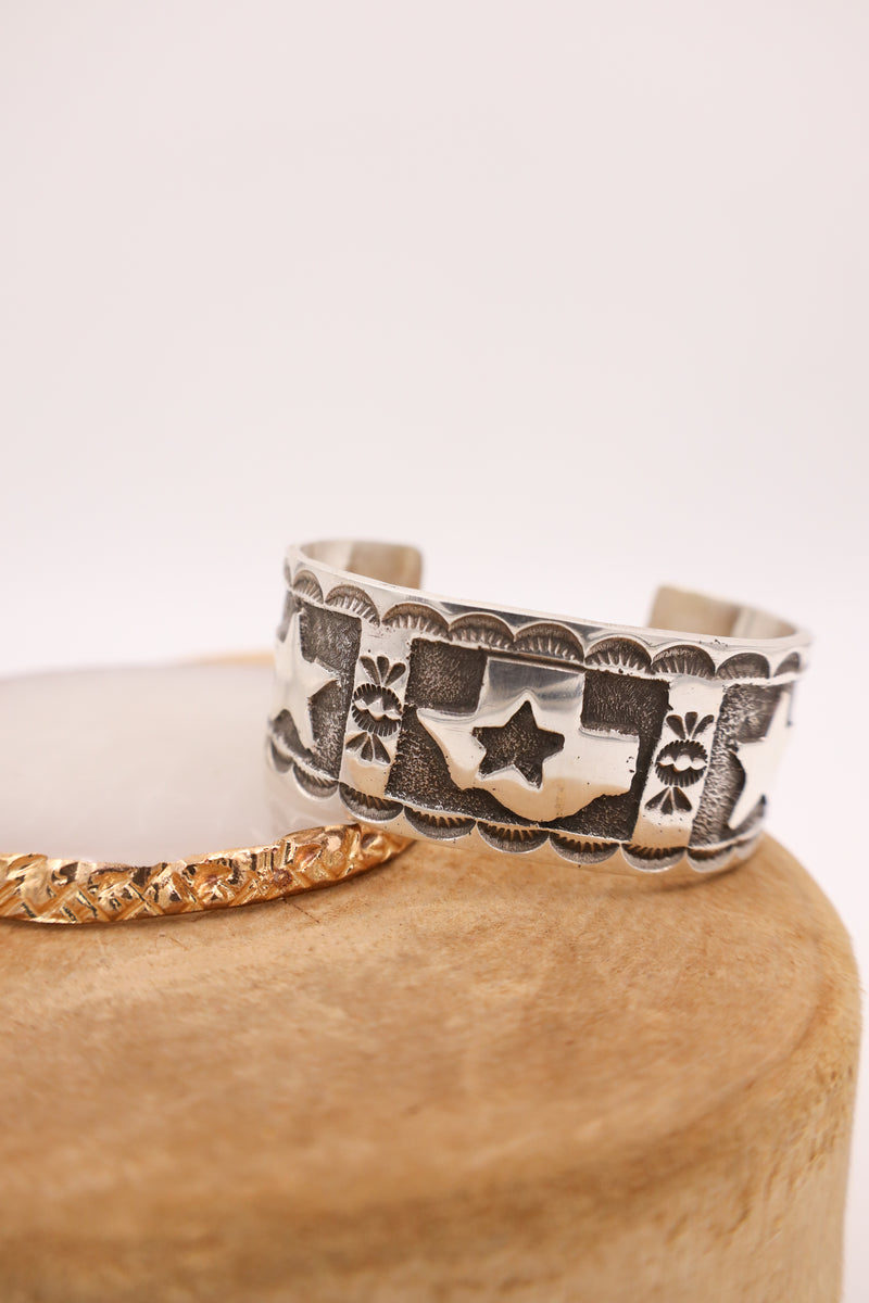 Sterling silver cuff with texas state in the center with stars on the sides