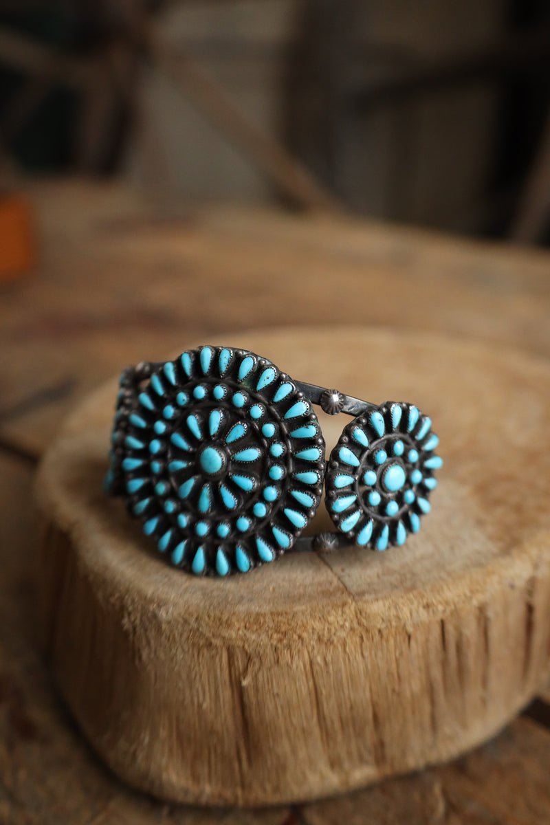 Turquoise beaded bracelet on a wooden surface