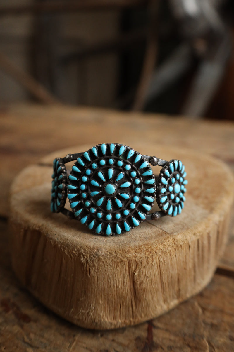 Turquoise beaded bracelet on a wooden surface