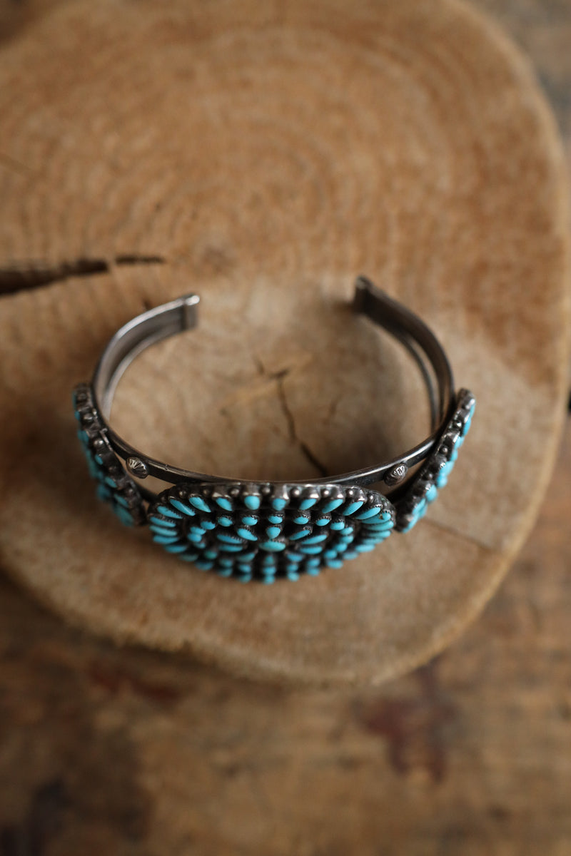 Turquoise bracelet on a wooden surface