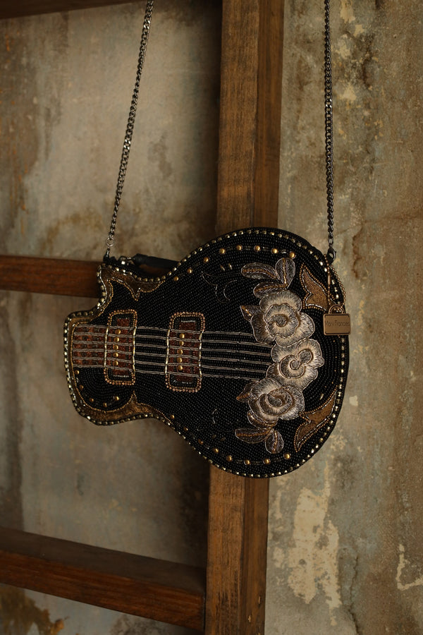 Hand beaded black electric guitar crossbody purse with gold accents with embroidered flowers on the base