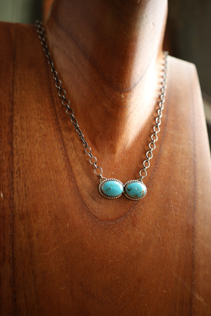 Necklace with turquoise stones on a wooden surface
