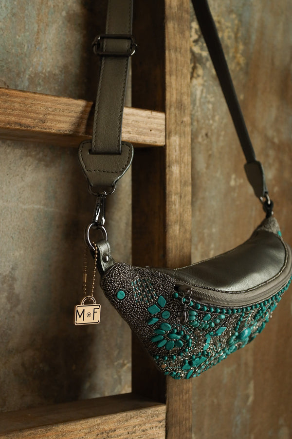 Beaded belt bag with turquoise, grey and stud beads all over the bag